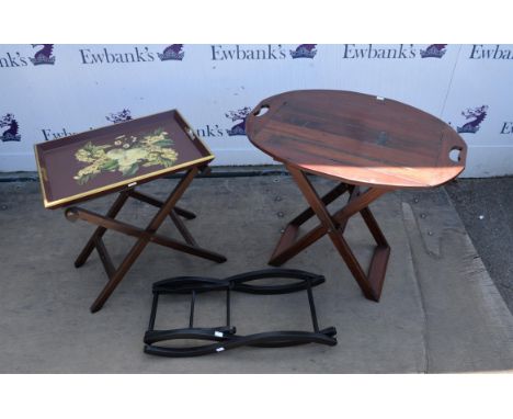 An African hardwood butlers tray on stand, 65cm high x 72cm wide  x 56cm deep, and a painted tray on stand with applied flora