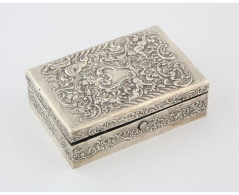 Edward VII silver stamp box by William Comyns & Sons, embossed with cherubs amongst foliate scrolls, the interior with three 