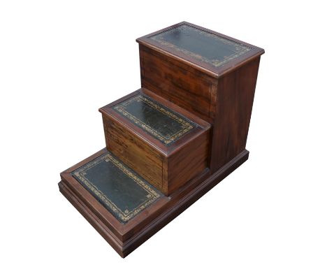 A set of Edwardian mahogany bed steps, with green tooled leather surfaces, 55.5cm high x 74cm wide x 42cm deep. Provenance: F