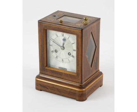 French rosewood veneered campaign clock with boxwood marquetry inlay, the silvered dial signed C. F. Petit. A. Paris, the mov