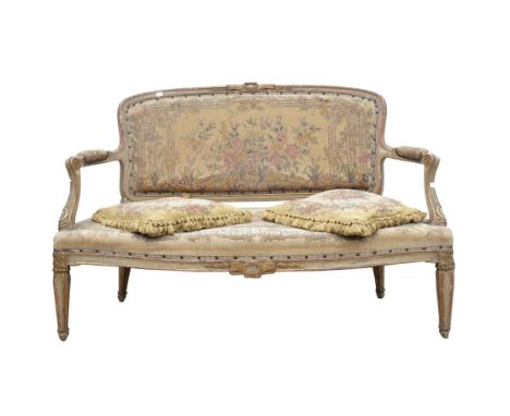 A French giltwood sofa, 20th Century, in the Louis XV style, with machine woven tapestry floral upholstery, 88cm high x 132cm