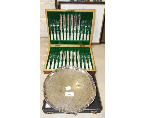 A cased set of twelve each mother-of-pearl-handled fruit knives and forks, a plated salver etc.