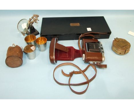 An A G Thornton drawing instrument set in Japanned box, a Zeiss Ikon camera, a nest of drinking cups and other items.