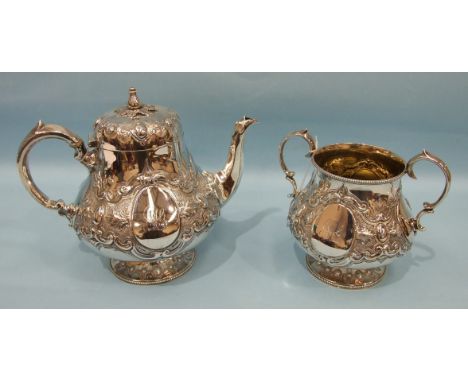 A Victorian silver teapot and sugar basin with overall embossed decoration and beaded borders, London 1866, maker TS, ___35oz