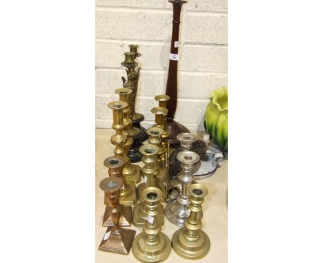 A pair of brass urn shape candlesticks on marble bases, 38cm high, five pairs of brass and one pair of plated candlesticks, a