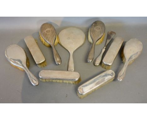 A London Silver Backed Six Piece Dressing Table Set, with engine turned decoration, retailed by Mappin & Webb, together with 