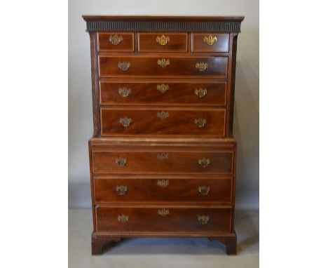 A George III Mahogany and Satinwood Inlaid Chest on Chest, the moulded cornice above three short and six long graduated drawe