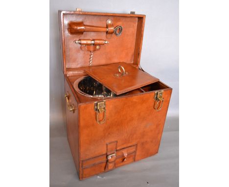 A Contemporary Leather Champagne Hamper, the hinged cover enclosing a fitted interior with various accessories and ice cooler