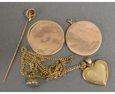 A 9ct. Gold Pendant in the form of a Heart with Chain, together with a fob seal, a 9ct. gold stick pin and a 9ct. gold locket