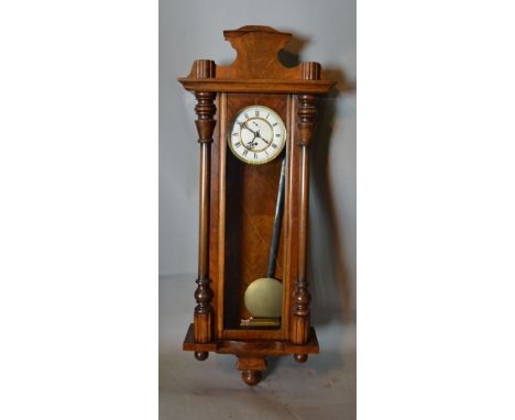 A Mahogany Weight Driven Vienna Type Wall Clock, the enamel dial with Roman numerals and single train movement, 120 cms long