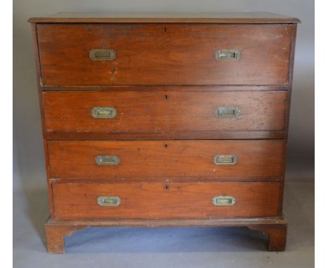 An Early 19th Century Military Secretaire Chest, the moulded top above a fully fitted secretaire drawer with alcoves and draw