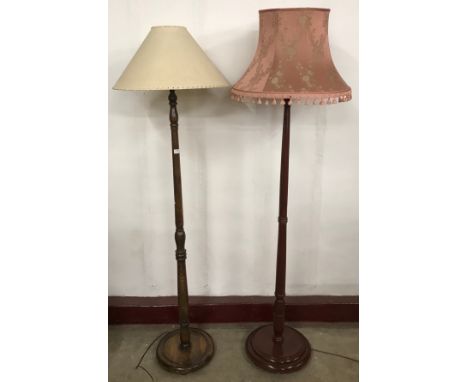 A mahogany standard lamp and an oak standard lamp 