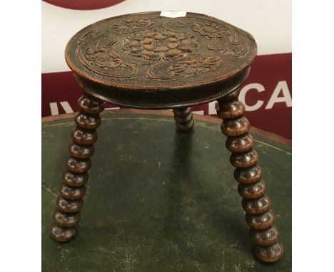 A Victorian carved oak bobbin turned stool 