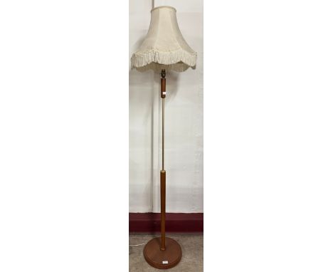 A teak standard lamp 
