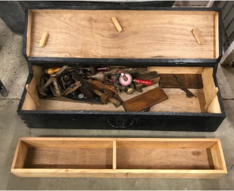 A vintage carpenter's tool box with tools 