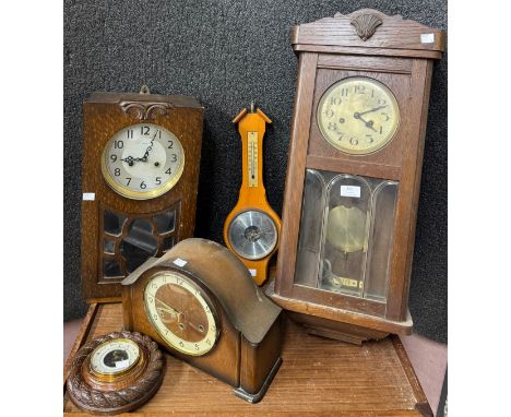 Two oak wall clocks, an oak mantel clock and two barometers