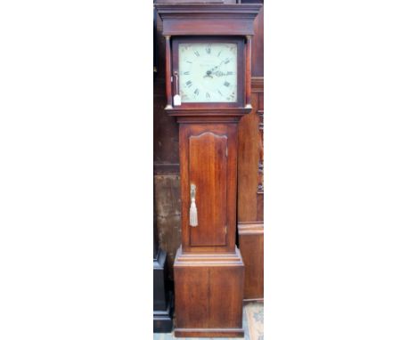 A George III oak 30 hour longcase clock, the hood with turned columns, the single door enclosing a white enamelled dial with 