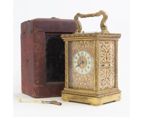 A late 19th Century Mappin & Webb retailed repeating carriage clock, brass corniche case with visible escapement window, gilt