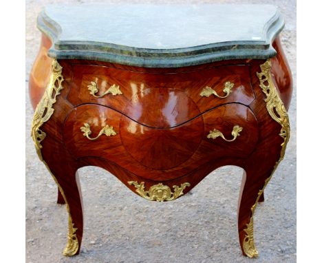 A 19th Century 'Bombe' commode, in the Louis XV style, having a marble top with moulded edge, fitted with two shaped drawers,