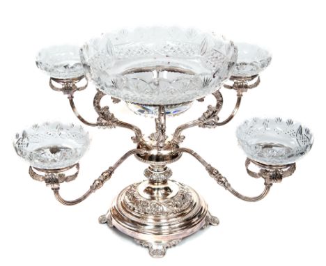 An Elizabeth II silver and cut glass epergne four branches radiating from a central column supporting a bowl on four foliate 