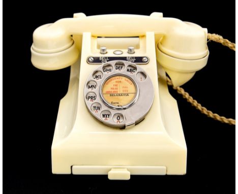 A rare 1950's ivory coloured GPO 300 series desk telephone, the handset dated 1952, cream braided flex, bell on/bell off faci