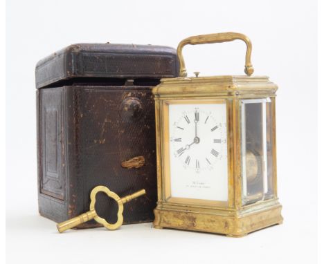 A late 19th Century French repeating carriage clock, brass corniche case, visible escapement window, white enamel Roman dial,