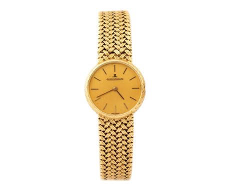 Jaeger Le Coultre, a lady's 18ct gold Jaeger Le Coultre wristwatch, 2cm circular dial with baton hands and numerals, backplat