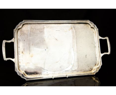 A George V silver plain rectangular twin handled tray, C W Fletcher & Son, Sheffield, 1934, 45.84ozt (1425.78 grams) together