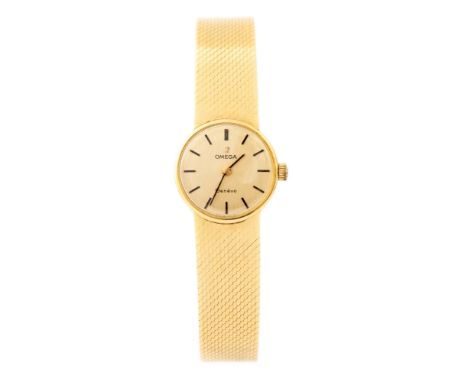 Omega, a circa 1960's lady's 18ct gold Omega wristwatch, 1.5cm circular dial with baton numerals, branded crown, integral 18c