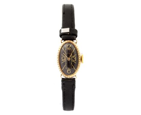 Cyma, a circa 1920's Cyma Swiss 14k gold cased lady's cocktail wristwatch, 1.3cm oval black dial, black leather strapConditio
