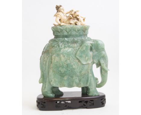 A Japanese ivory okimono, first quarter of the 20th Century, carved in the Chinese style as a reclining female wearing a jewe