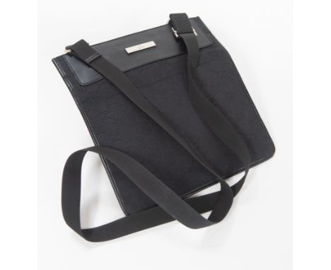 GUCCI messenger bag, with GG monogram print in black canvas, leather top trim detail, zip top fastening along with two slip p