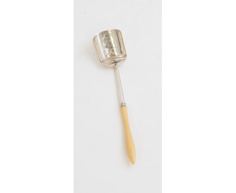 A George III silver caddy spoon, the shovel shaped bowl engraved with a crest within shield shaped cartouche, ivory handle,IT