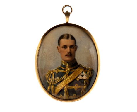An Edwardian oval portrait miniature of a moustached gentleman in military unifrom wearing medals, on ivory, mounted in a sil