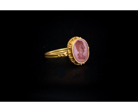 Roman (2nd century AD) Gold ring with ribbed band, granule decoration to the shoulder; oval bezel with granule decoration to 