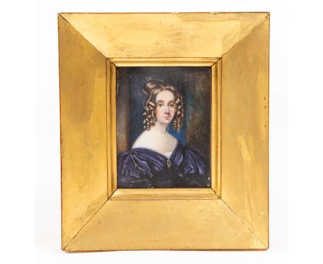 A mid 19th Century portrait miniature of a young lady in a purple dress, circa 1830's, on ivory, 9cm by 6cm, in a gilt frame 