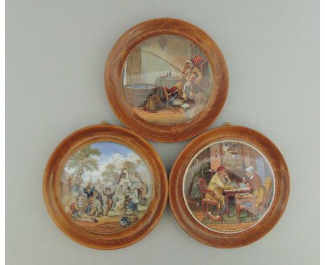 Three Staffordshire Prattware polychrome pot lids, mounted in light wooden frames, titled 'The Enthusiast', 'The Village Wedd