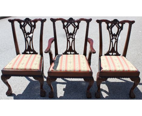 A set of fourteen early 20th Century mahogany dining chairs, of Chippendale design, fitted with drop-in upholstered seats (14