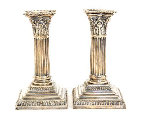 A pair of Victorian silver Corinthian column dwarf candlesticks, on stepped gadrooned bases, Hawksworth, Eyre & Co., Sheffiel