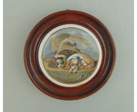 A Staffordshire Prattware polychrome pot lid mounted in a light wooden frame, titled 'Pompey & Caesar', circa 1880,   8cm dia