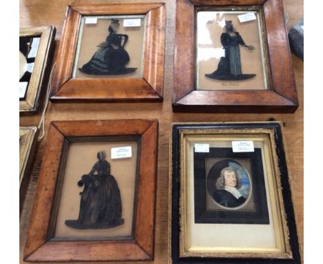 Three 19th Century reverse painted silhouette portraits on glass, ladies in costume, in the original birds eye maple frames, 