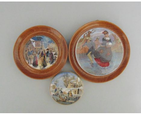 Three Staffordshire Prattware polychrome  pot lids,   two mounted in light wood frames, titled  'The Skaters', 'Xmas Eve' and