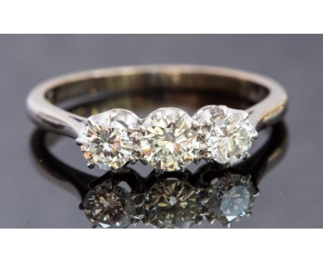 A diamond three-stone 18ct white gold ring, three round brilliant cut diamonds weighing total approx 1 carat, ring size R, to