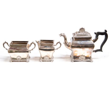 A Victorian silver three piece bachelors teaset, bombe form with gadrooned and foliate decoration on scroll bracket feet, Lon