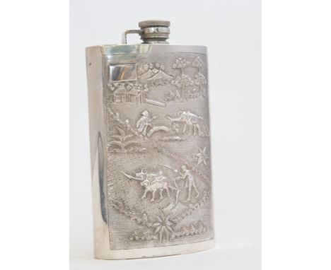 An Asian silver large hip flask, the front chased with elephant, oxen ploughing and figures within pastoral scene, stamped St