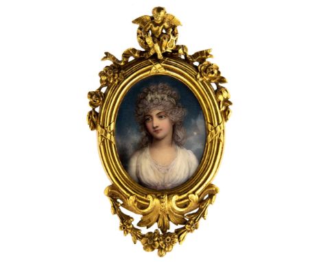 A George III oval portrait miniature of a beautiful young lady in a white dress, on ivory, 8cm by 6cm, in a later cast gilt m