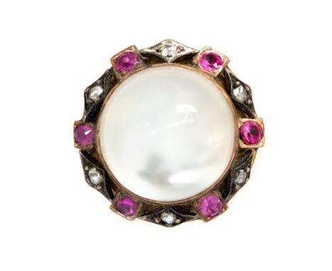 A 19th century moonstone, diamond and ruby hat pin, the cabochon moonstone surrounded by six round-cut rubies divided by rose