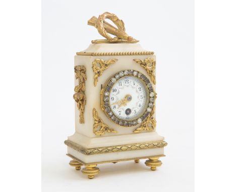A late 19th Century French alabaster boudoir timepiece, circa 1880, of Neoclassical design, gilt metal mounts, paste set beze