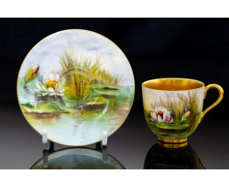 A Royal Worcester cabinet cup and saucer, painted by W H Austin with waterlily, gilt interior (2)