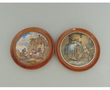 Two Staffordshire Prattware polychrome pot lids mounted in light wooden frames, titled 'The Farriers' and 'Country Quarters',